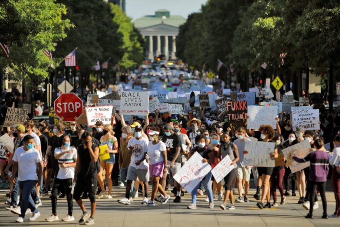 Thousands march through the streets during nationwide unrest following the death in Minneapolis police custody of George Floyd, in Raleigh